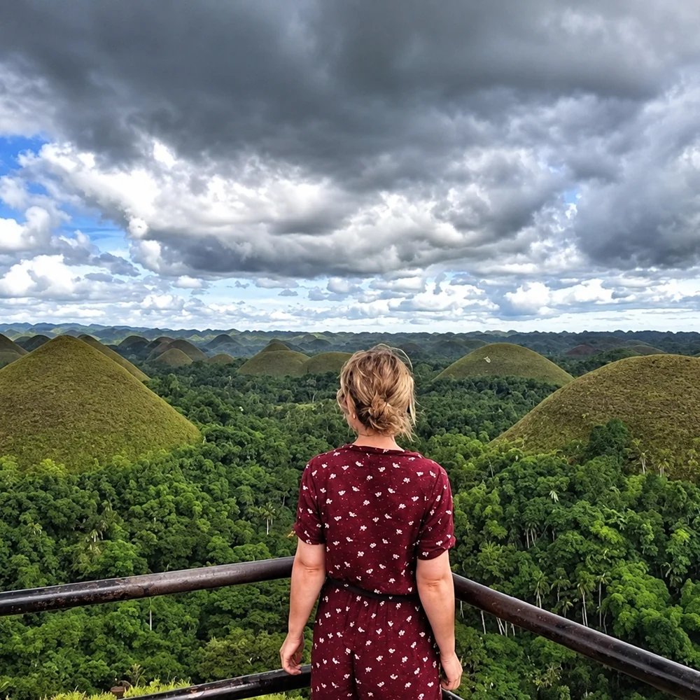 A visitor at the viewing deck overlooking the Chocolate Hills in Bohol